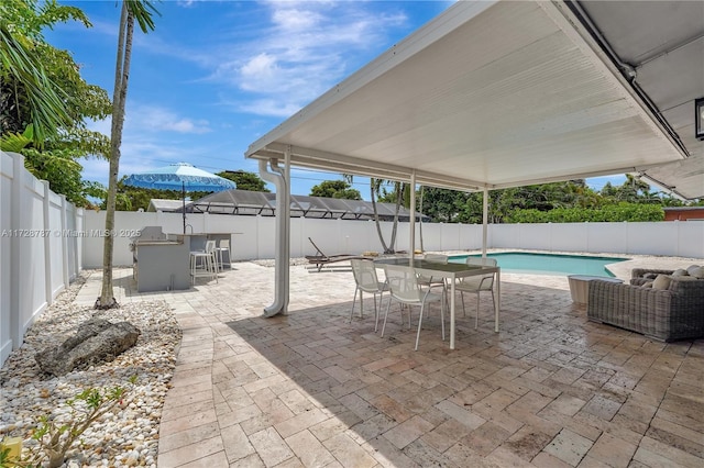 view of patio with a fenced in pool and exterior bar