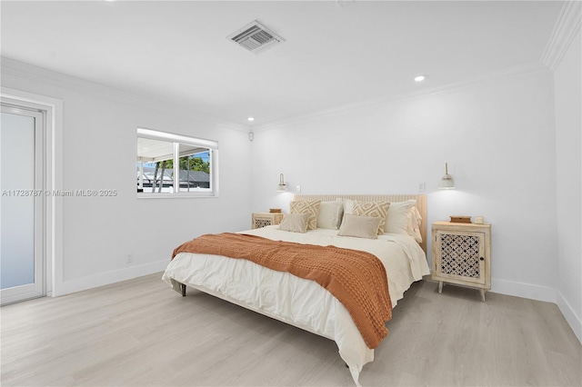 bedroom with crown molding and light wood-type flooring