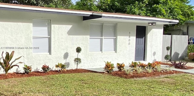 property entrance with a yard