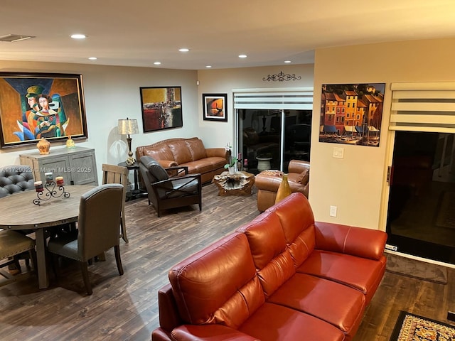 living room with dark hardwood / wood-style flooring