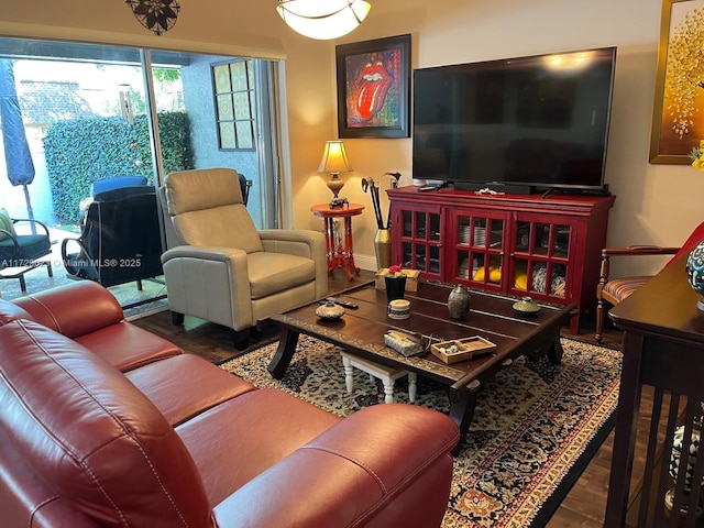 living room with wood finished floors and baseboards