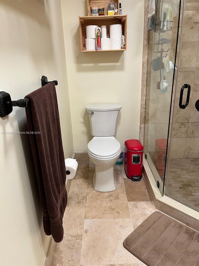 full bathroom featuring toilet and a stall shower