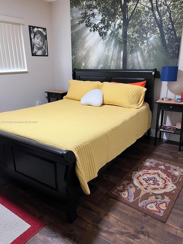 bedroom featuring wood finished floors