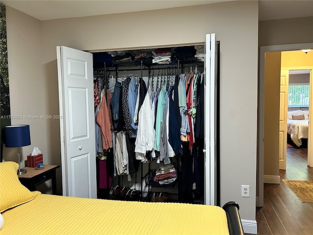 bedroom with a closet and wood finished floors