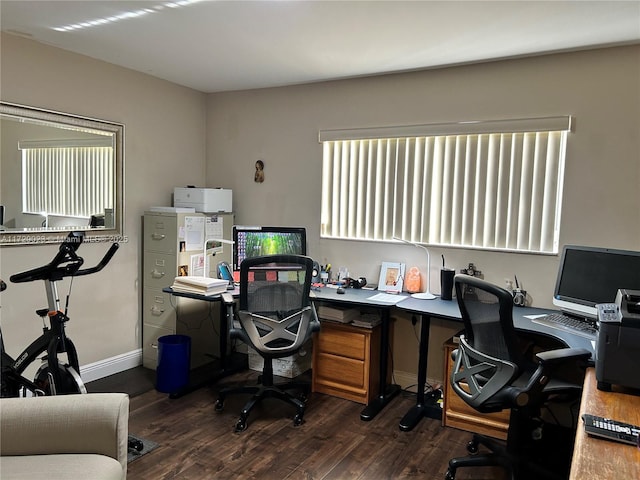 office space with baseboards and dark wood-style floors