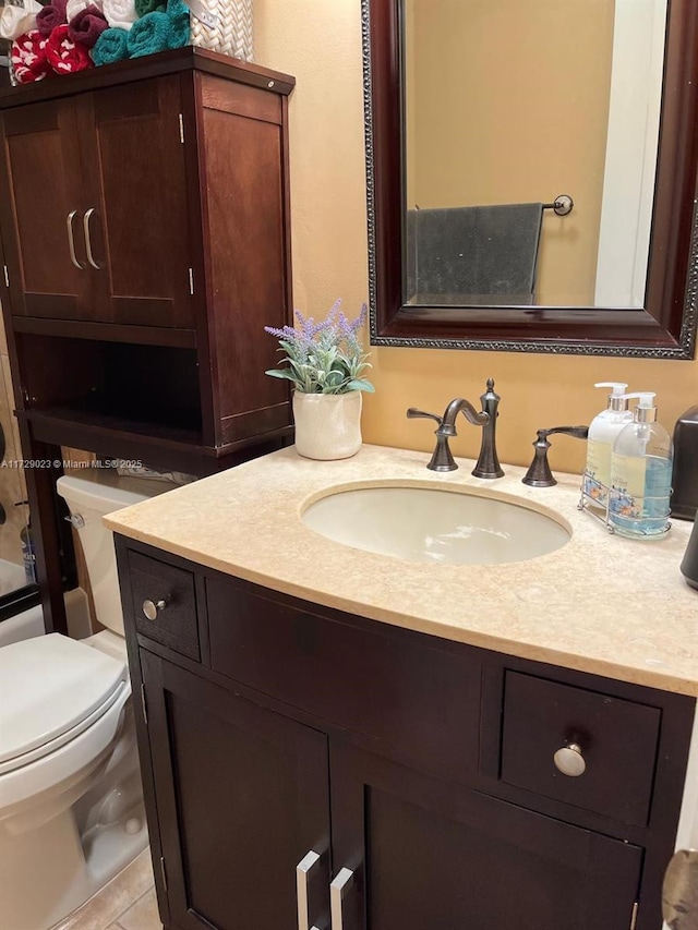 full bathroom featuring toilet, vanity, tile patterned floors, and shower / bath combination with glass door