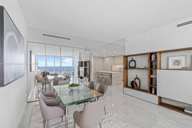 dining area with floor to ceiling windows