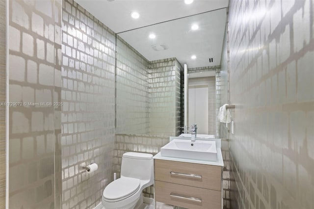 bathroom featuring toilet and vanity