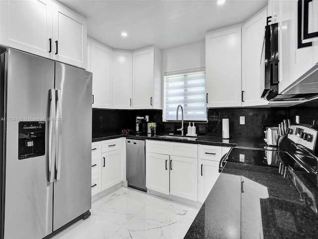 kitchen with white cabinetry, sink, and stainless steel appliances