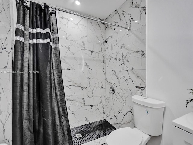 bathroom with curtained shower and toilet