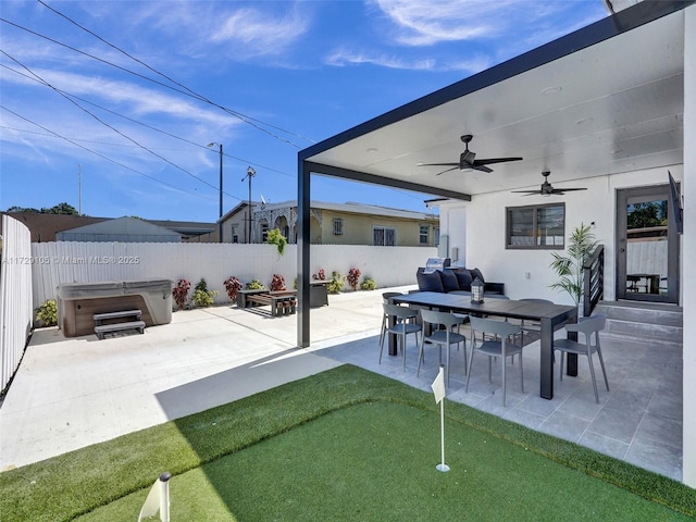 view of patio featuring a hot tub and ceiling fan