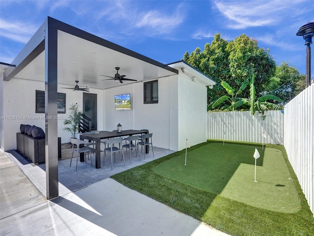 view of patio / terrace featuring ceiling fan