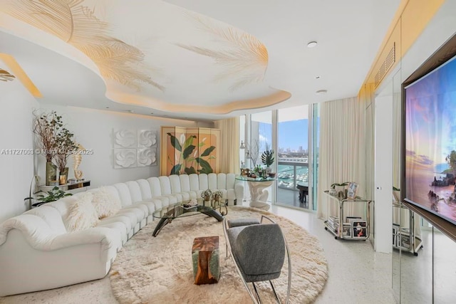 living room with floor to ceiling windows