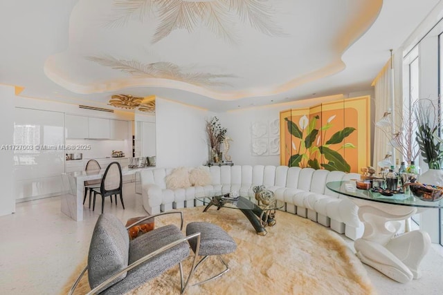 living room with a tray ceiling