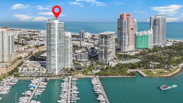 birds eye view of property featuring a water view