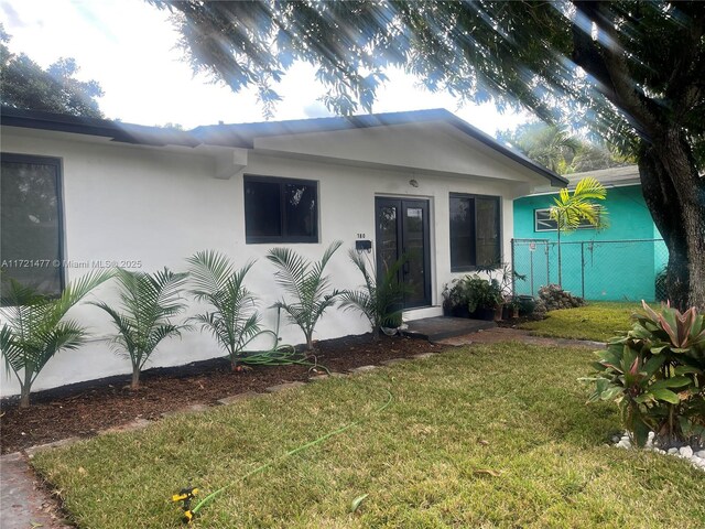 view of front of home with a front yard