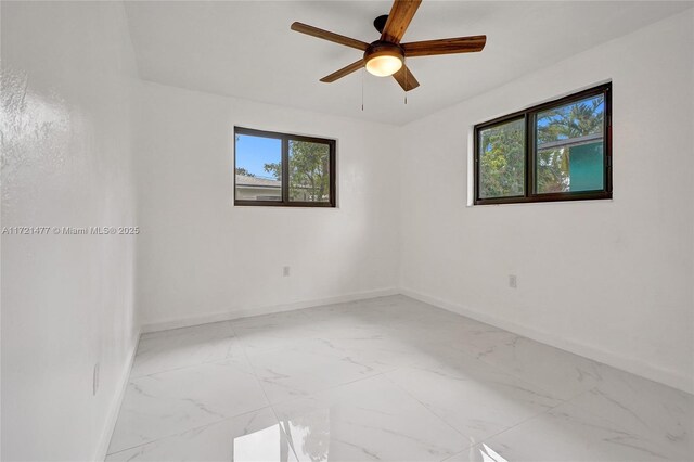 spare room featuring ceiling fan