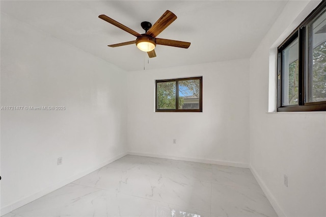 unfurnished room featuring ceiling fan