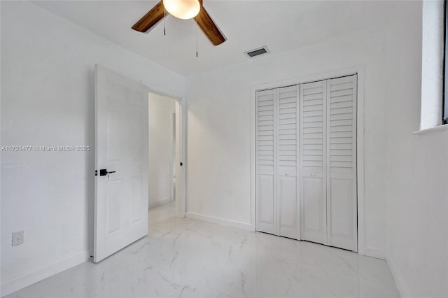 unfurnished bedroom featuring a closet and ceiling fan