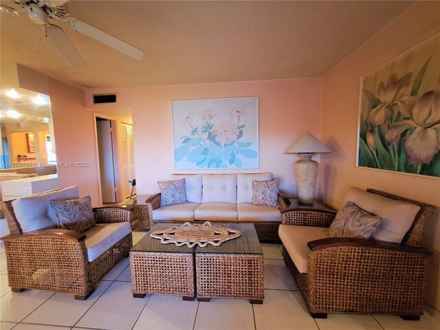 sunroom featuring ceiling fan