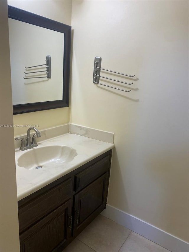 bathroom featuring tile patterned flooring and vanity