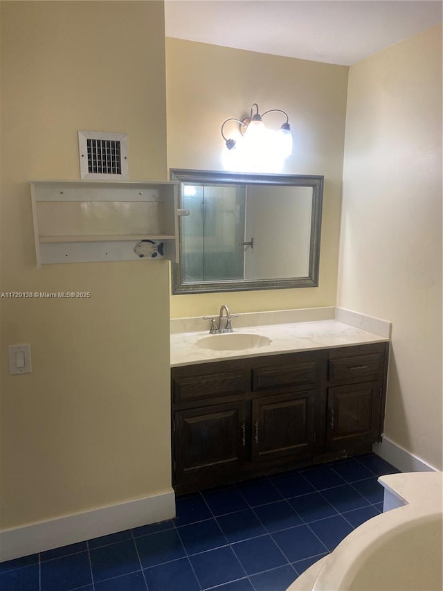 bathroom with vanity and tile patterned floors