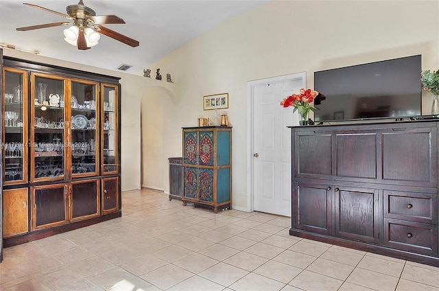 interior space with vaulted ceiling and ceiling fan