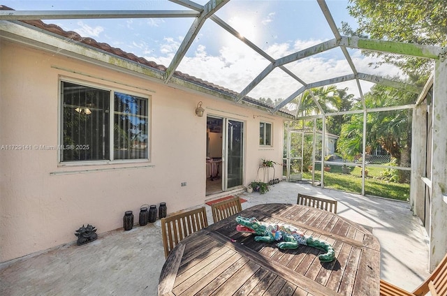 view of patio / terrace featuring glass enclosure