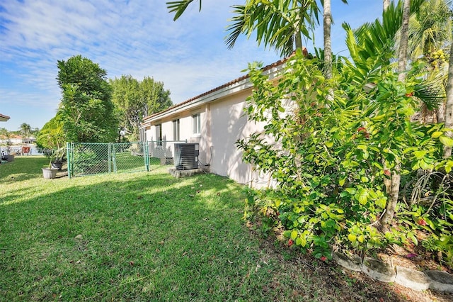 view of yard with central AC