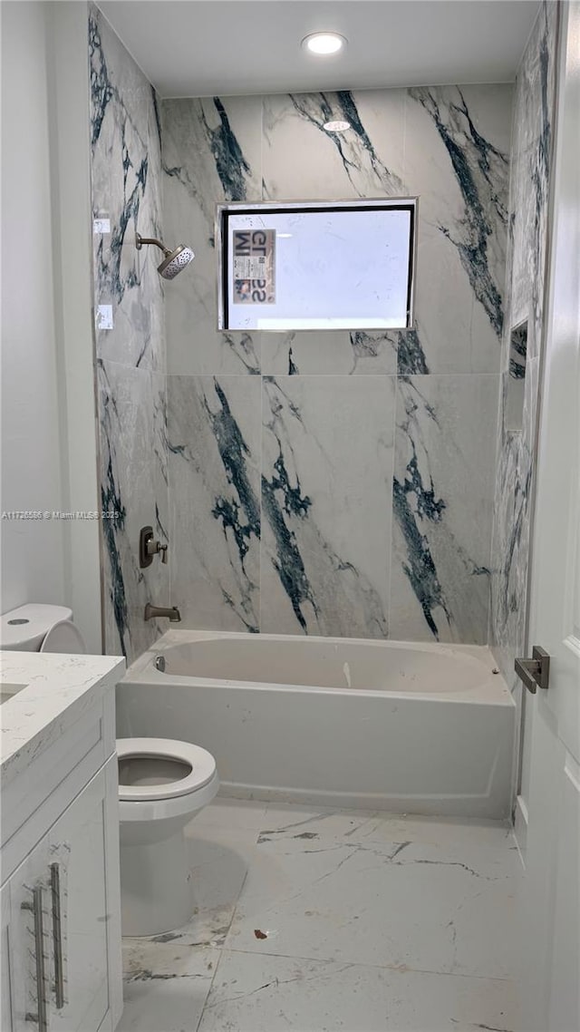 full bathroom featuring tub / shower combination, toilet, and vanity