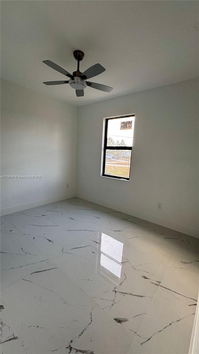 spare room with ceiling fan