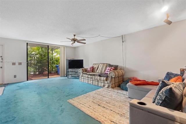 living room featuring carpet floors, a textured ceiling, floor to ceiling windows, and ceiling fan