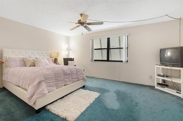 bedroom featuring ceiling fan, carpet, and a textured ceiling