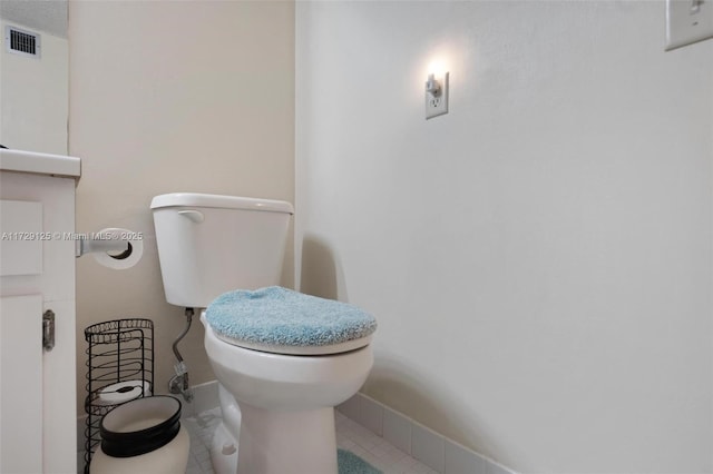 bathroom featuring toilet and tile patterned floors