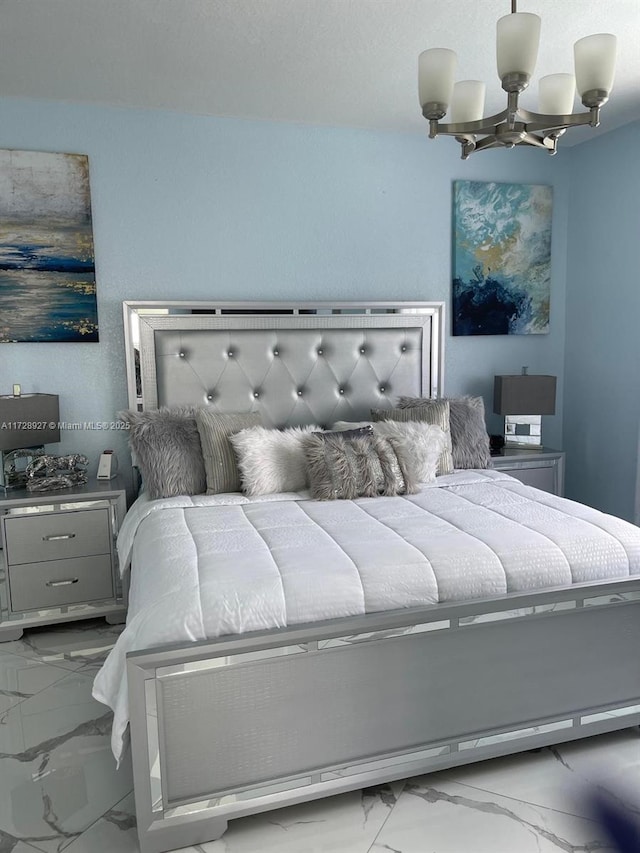 bedroom with an inviting chandelier