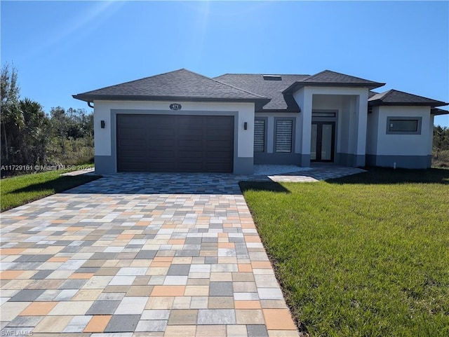 view of front facade with a front lawn and a garage