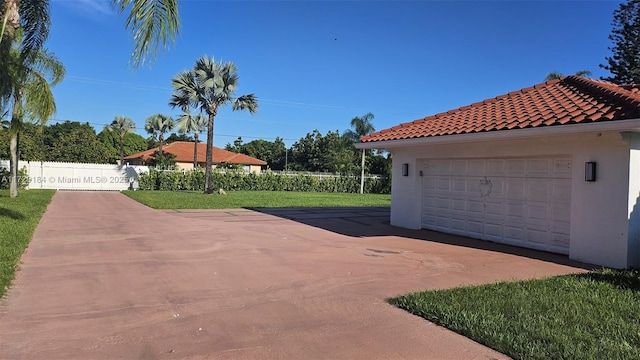 garage featuring a yard