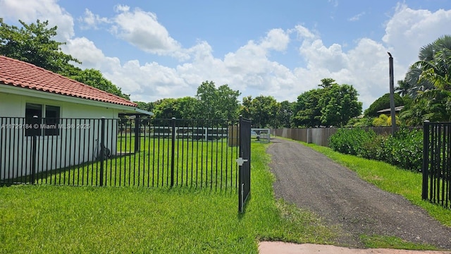16400 SW 173rd Ave, Miami, FL 33187 - view of dirt / gravel road featuring a gated entry