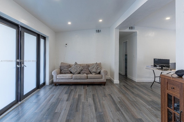 living room featuring french doors and dark wood-type flooring