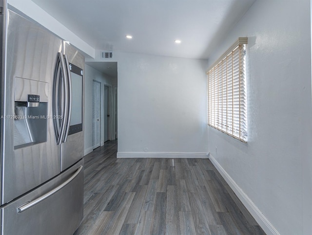 kitchen with stainless steel refrigerator with ice dispenser and dark hardwood / wood-style flooring