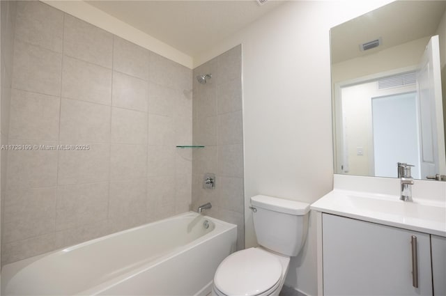 bathroom featuring visible vents, vanity, toilet, and shower / bathtub combination