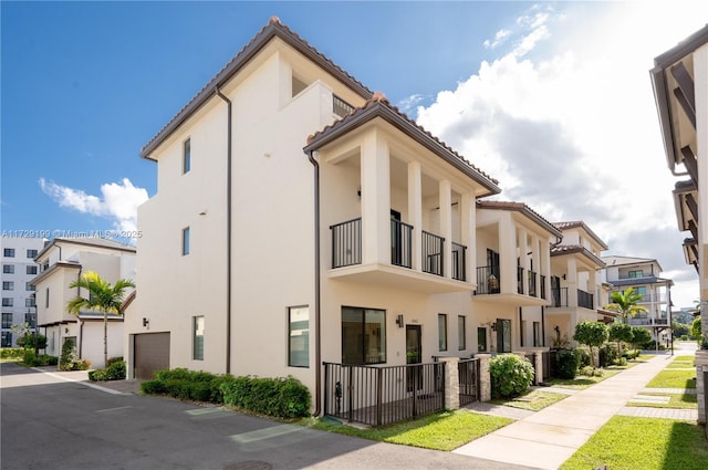 view of property with an attached garage and a residential view