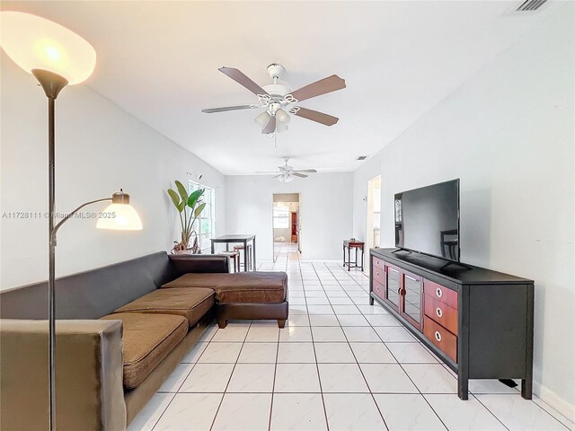 tiled dining space with ceiling fan