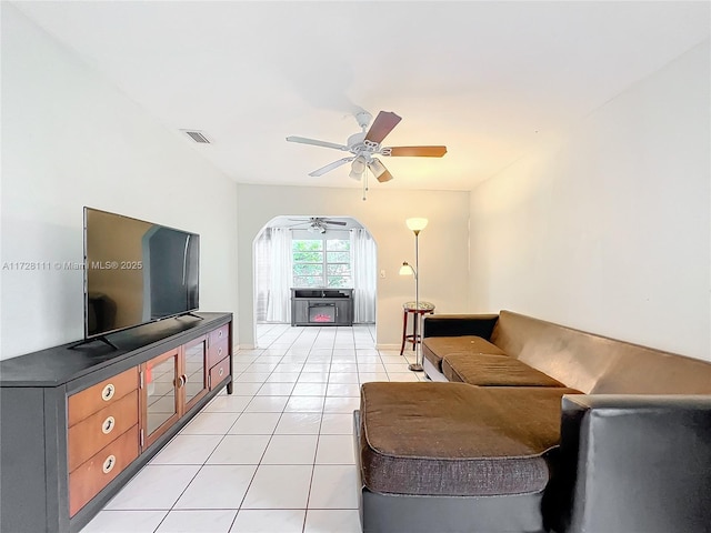 living room featuring ceiling fan and light tile patterned floors