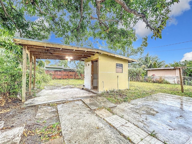 view of patio / terrace featuring a storage unit