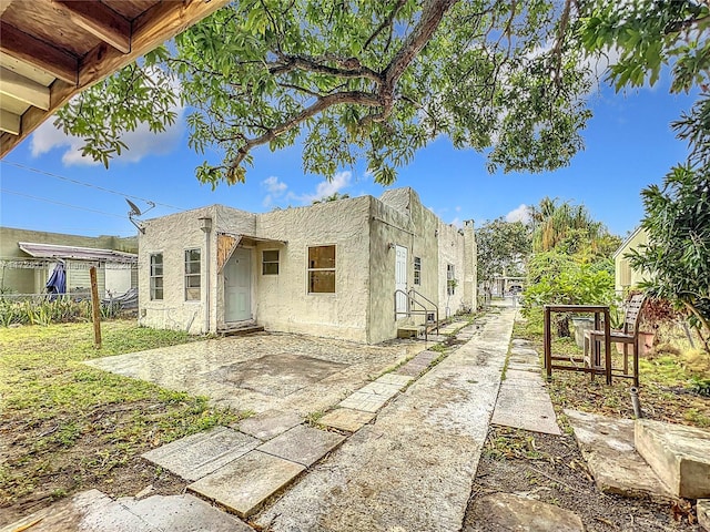 view of side of home featuring a patio area