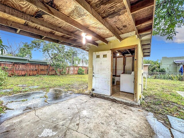 view of property exterior featuring central AC unit and a lawn