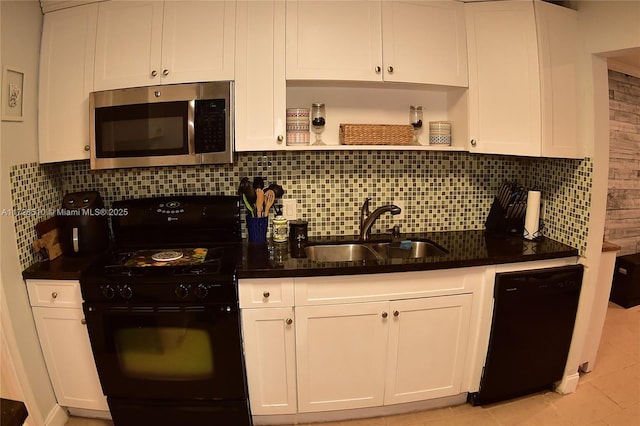 kitchen with black appliances, white cabinetry, decorative backsplash, sink, and light tile patterned floors