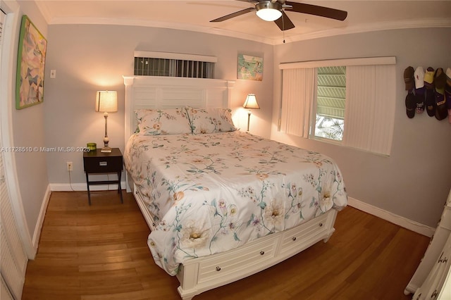 bedroom featuring ceiling fan, crown molding, and dark hardwood / wood-style floors