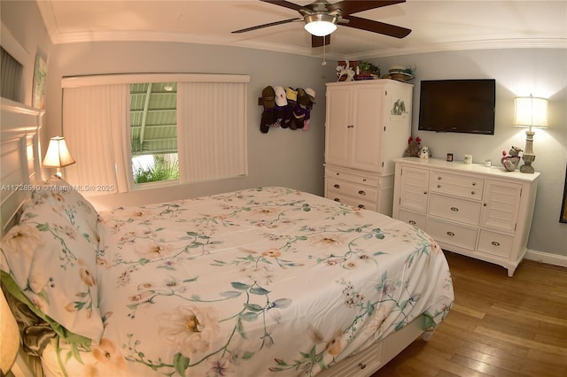 bedroom with ceiling fan, wood-type flooring, and crown molding